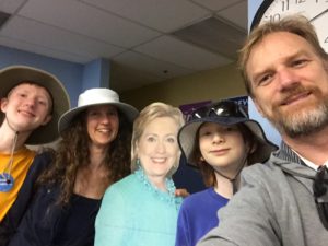 My family and I posing with carboard cutout of Hillary Clinton after campaigning for her door to door in Nevada.